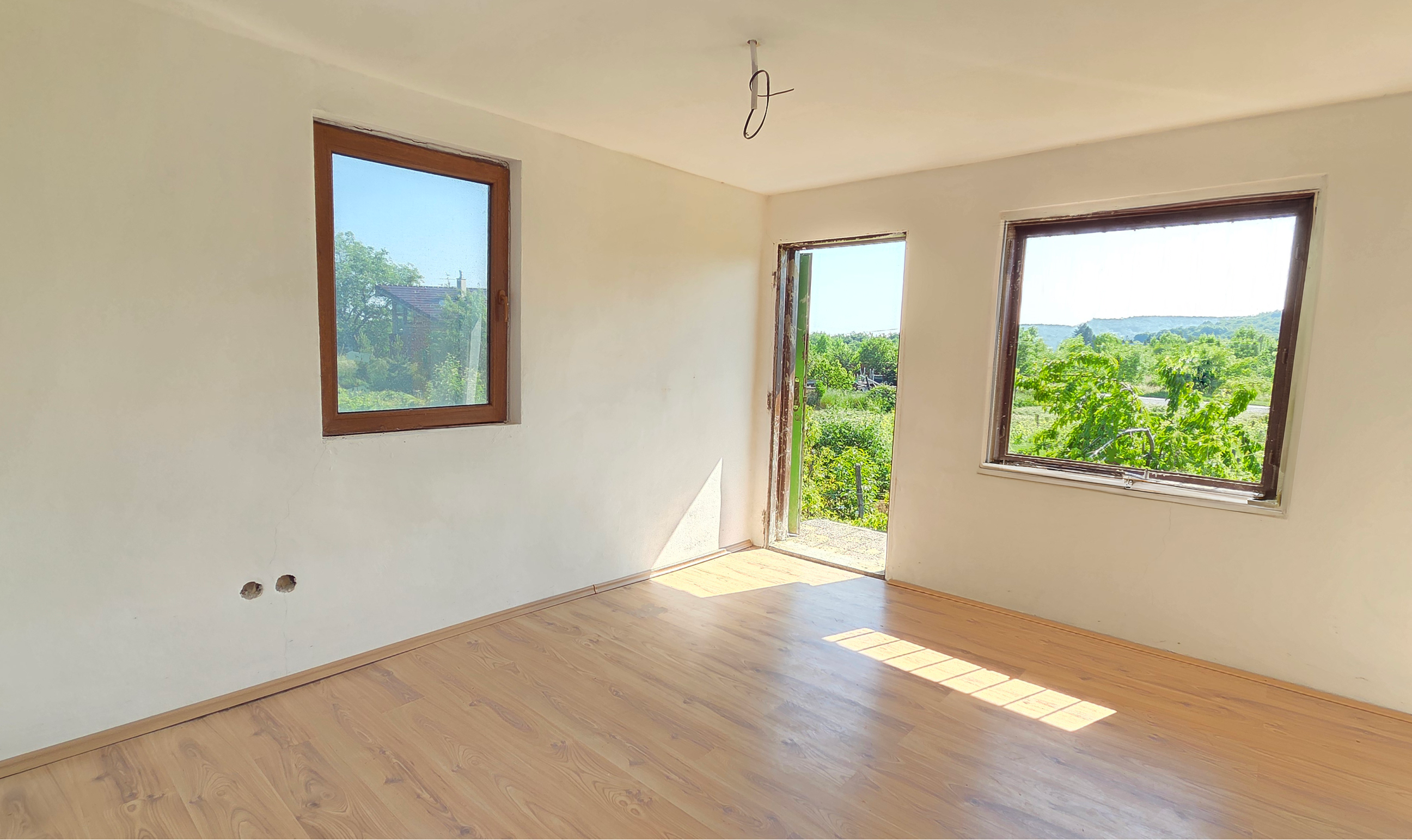 Rekreačný domček s pekným pozemkom v Harmónii. NOVÁ CENA